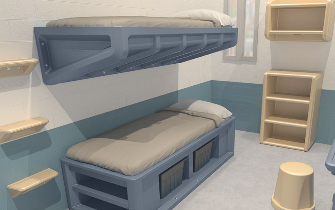 Custodial cell fitted with an anti-ligature bunk, shelving and under-bed storage