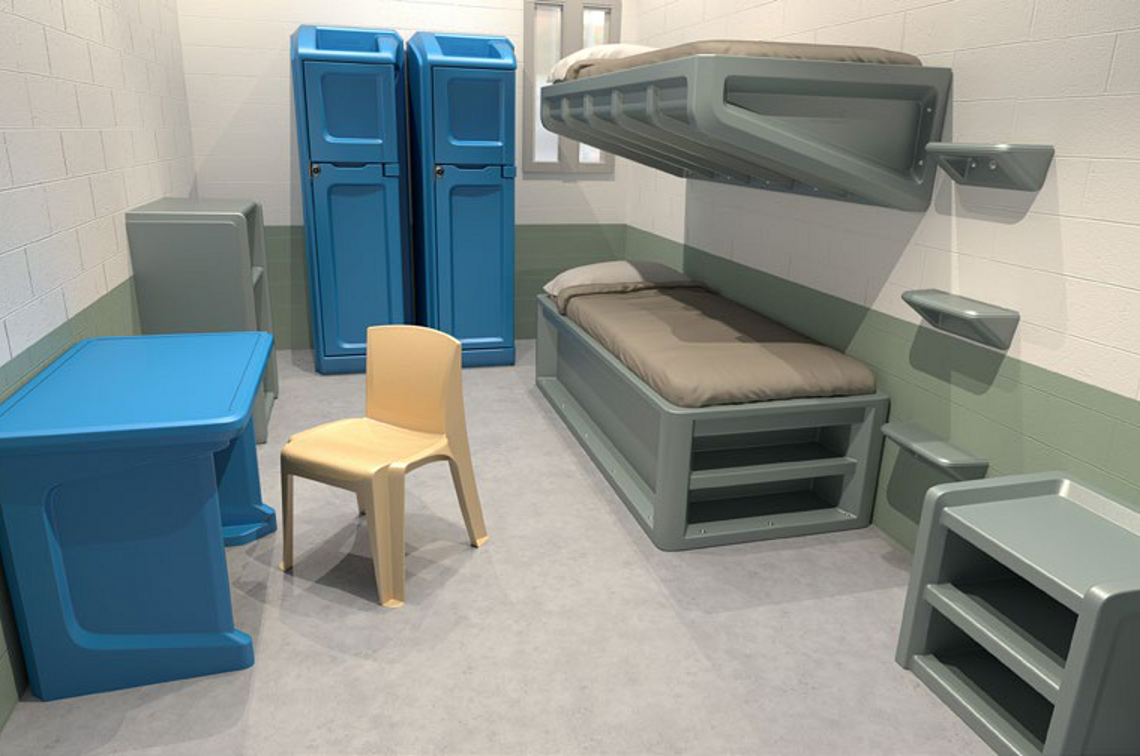 Custodial cell fitted with anti-ligature bunk, desk, seating and storage